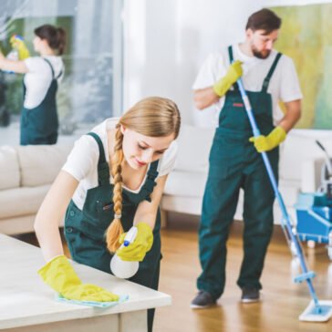 Cleaning service employees with professional equipment cleaning